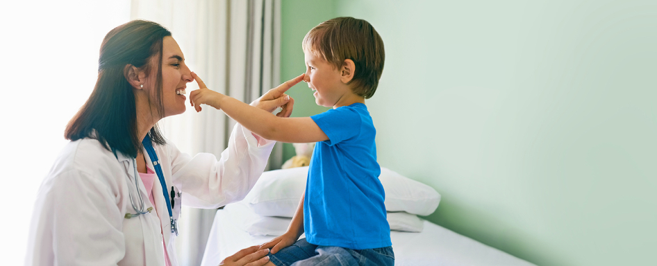 Doctor and Child pointing others nose
